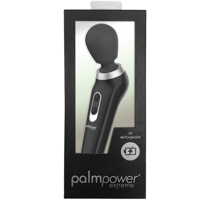 A Palm Power Extreme Rumbly Ergonomic Wand Vibrator from BMS Enterprises, featuring a black wand with a rounded head made from medical grade silicone, is displayed in its packaging. The black box has a clear plastic window to showcase the item and text that reads “palmpower extreme,” indicating the powerful wand is USB rechargeable.