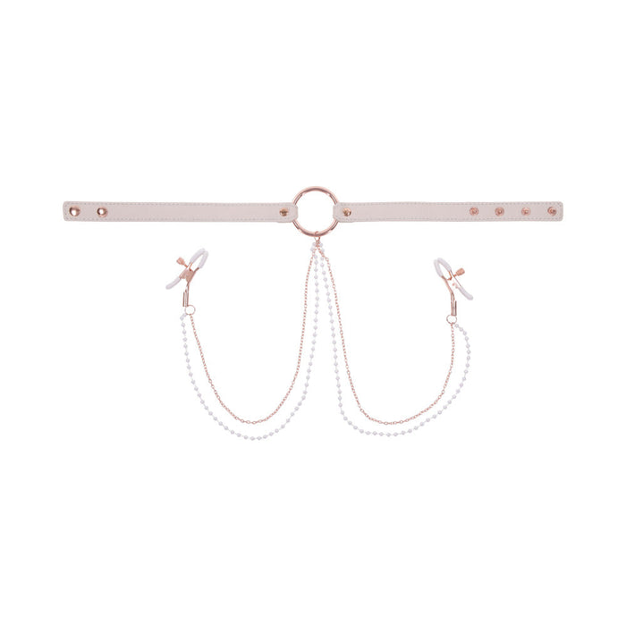 The Peaches 'n Cream Collar and Nipple Clamps by Sportsheets features a white adjustable collar with a central metal ring and rose gold hardware. Two chains decorated with small white beads extend to clips on either end, resembling nipple clamps. The collar's size can be adjusted using multiple snap buttons, providing an elegant and delicate design.