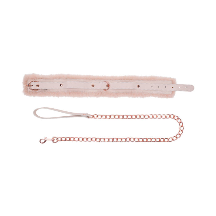 The Peaches 'n Cream Fur Collar and Leash by Sportsheets evokes Intimate Moments with its light pink fluffy collar and adjustable leather strap. It includes a rose gold chain leash with a loop handle and clasp, all beautifully displayed on a white background, capturing the essence of gentle bondage perfectly.