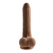 The Peek A Boo Uncut Vibrating 8" Silicone Caramel Dildo by Evolved Novelties flaunts a realistic foreskin design with pronounced veins and textured details. It features a powerful suction cup base resembling testicles, all set against a plain white background.