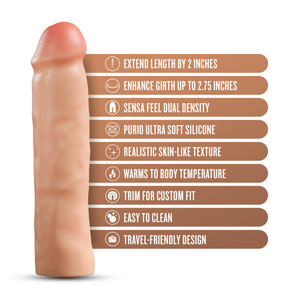 The Performance Plus 2 Inch Silicone Penis Extender by Blush is showcased next to a list of features, including extending length by 2 inches, enhancing girth up to 2.75 inches, dual density, ultra-soft silicone with a realistic texture that warms to body temperature, customizable trim for the perfect fit, easy cleaning convenience, and a travel-friendly design.