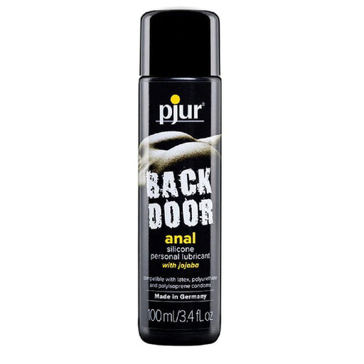 A sleek black bottle of Pjur Backdoor Glide Silicone Anal Lubricant - Various Sizes, an anal sex silicone lubricant enriched with jojoba. The label confirms compatibility with latex, polyurethane, and polyisoprene condoms. This 100ml/3.4 fl. oz. product proudly declares its German craftsmanship for a premium experience.