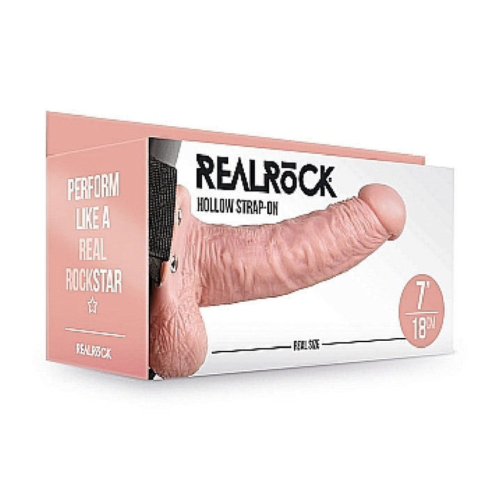 Product packaging for a "Realrock 7 Inch Hollow Dildo with Balls & Strap-on Harness - Vanilla" with an illustration of the product on the front, featuring the text "perform like a rockstar" and indicating a size of 7 inches.