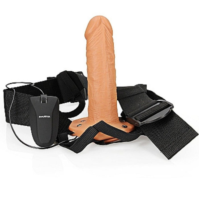 Realrock Vibrating 6 Inch Hollow Dildo & Strap-on Harness all together standing upward on a white background