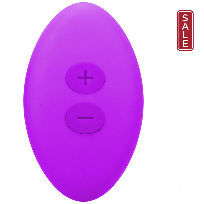 A purple, oval-shaped remote control by Doc Johnson, featuring a plus (+) and minus (-) button on its front surface for adjusting settings, included with the Remote Controlled Panty Vibrator for Beginners in a Bag.