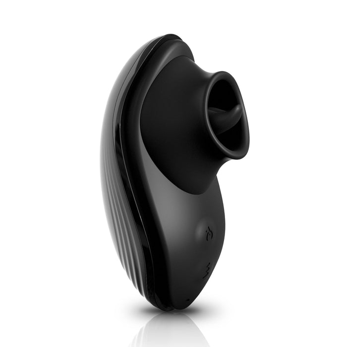 A close-up image of the Rim Joy Rimming Warming Tongue Vibrator by Pipedream Products. The vibrator boasts a sleek, ergonomic design with a curved outer shell and a soft, textured tip for comfortable use. The surface includes intuitive controls and possibly a charging contact point. Featuring a waterproof design, the background is white.