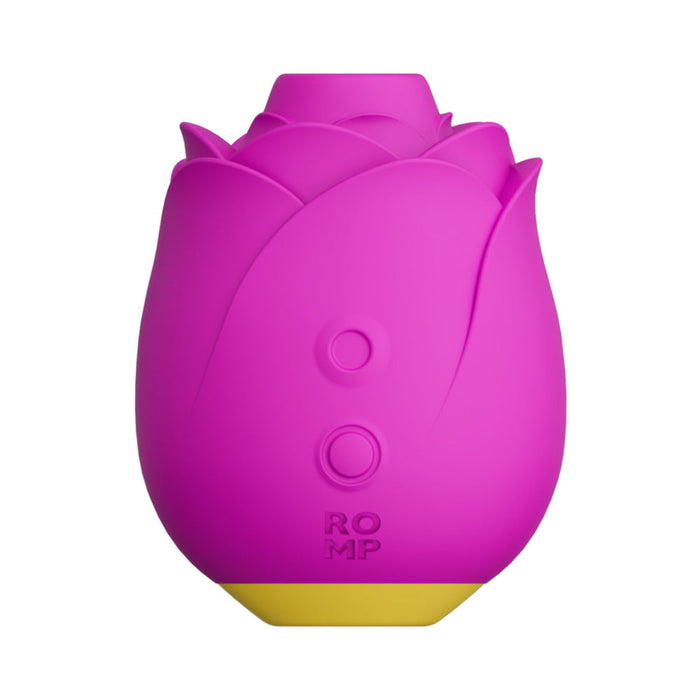 A bright pink, flower-shaped personal massager with petal-like layers and two circular buttons on its front. The base is yellow, featuring the word "ROMP" near the bottom. Resembling a closed tulip, this silicone-coated toy by WOW offers premium sensations and is named the Romp Rose Pleasure Air Clitoris Stimulator.