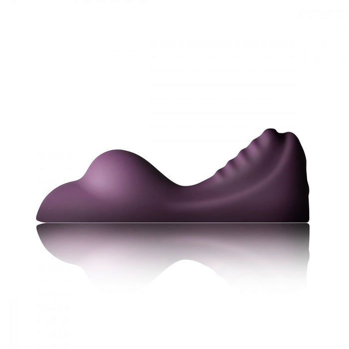 The Ruby Glow Ride On External Hands-Free Humping Vibrator by Rocks Off, in a dark purple shade, features a smooth, contoured surface and a reflective base. Designed with a wave-like shape to provide comfort and promote proper posture, this non-penetrative vibrator has varying heights to accommodate different body parts.