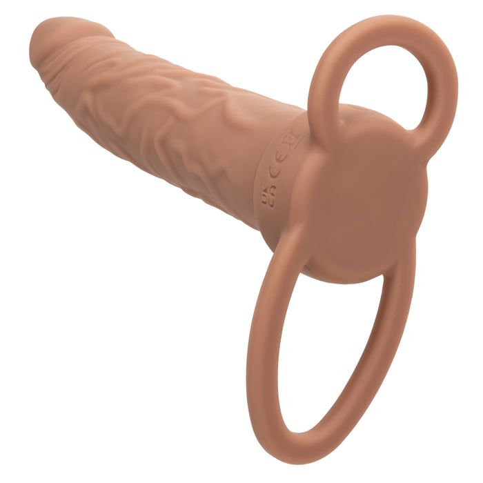 The Performance Maxx Double Penetration Vibrating Dildo in Light Chocolate is a silicone sex toy with realistic veins, a defined tip, and a looped handle for easy grip, ideal for lifelike or adventurous anal experiences.