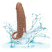 The light chocolate silicone Performance Maxx Double Penetration Vibrating Dildo, equipped with a suction base, stands vertically in water creating dynamic splashes against a white background, enhancing its visual appeal for double penetration.