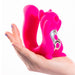 A pink, squirrel-shaped adult toy from Natalie's Toy Box named the Screaming Squirrel Air Pulsation Clitoral and G Spot Vibrator, with a metallic section on its belly rests in the palm of a hand. Displaying light lavender nail polish, the hand holds a toy featuring clitoral stimulation and vibration capabilities. The background is white.