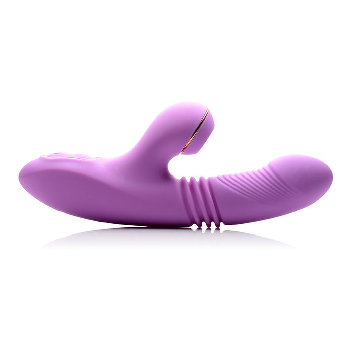 The Shegasm Thrusting & Clitoral Air Pulsation Rabbit Vibrator by XR Brands is a luxurious, dual-action device in purple silicone. Its curved design includes one end with a bulbous shape and raised edge, while the other features a ribbed, phallic form. This innovative vibrator also offers thrusting vibrations for enhanced stimulation and ergonomic support.