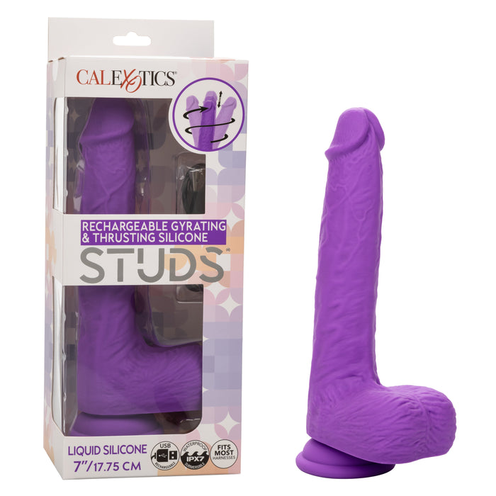 A pink silicone dildo with a realistic design, featuring a base with a suction cup. Boasting intense action, the packaging next to it reads "CalExotics Silicone Stud: Rumbling & Thrusting 9.5 Inch" with product specifications of 9.5 inches/24 cm length.