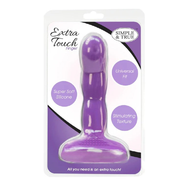 A packaged silicone sex toy in purple, branded as "Simple and True Silicone G-Spot Finger Extender" by BMS Enterprises. The packaging emphasizes its "Universal Fit," "Stimulating Texture," and "Super Soft Silicone" features, ideal for G-spot stimulation. The product is showcased against a white background with purple accents.