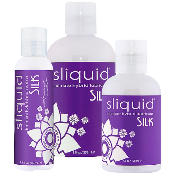 Three bottles of Sliquid Silk Water/Silicone Hybrid Lubricant in different sizes, featuring a purple and white color scheme and a floral motif.