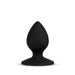 A black silicone butt plug with a teardrop shape and a flared base is centered on a plain white background. The Blush Slut Silicone Butt Plug's material appears smooth and slightly matte, ensuring it is body safe.