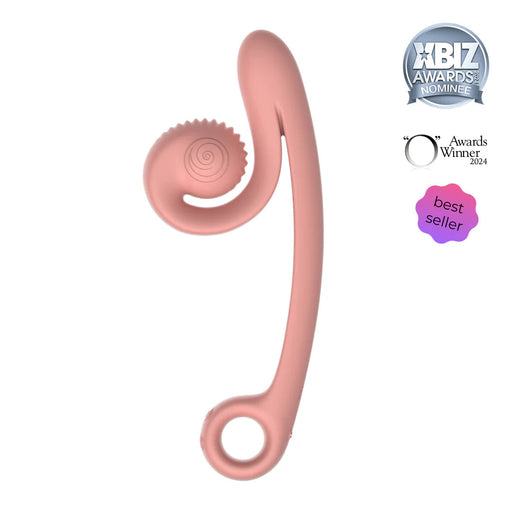 A peach-colored, elongated, U-shaped device with a ring on one end and a textured, circular component on the other. The Snail Vibe Curve Ultra Powerful 2 Motor Dual Stimulating Vibrator by Snail Vibe boasts powerful motors designed for g-spot stimulation. It proudly displays accolades such as "XBIZ Awards Nominee," "O Awards Winner 2024," and a "best seller" badge.