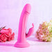 The Somebunny to Love Uncut Look Rabbit Vibrator by Evolved Novelties, featuring a pink silicone exterior with powerful motors, a curved shaft, and a smaller curved extension, is displayed upright against a light pink background. On the left side of the toy is a bouquet of pink roses, while on the right side is a cluster of green and pink hydrangeas.