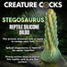 A promotional image for the Stegosaurus Spiky Reptile Silicone Dildo by XR Brands, a silicone sex toy shaped like a stegosaurus tail. This spiky dildo is tapered for easy insertion and features a strong suction cup base. Set against a jungle background, the text highlights its unique design and user-friendly features.