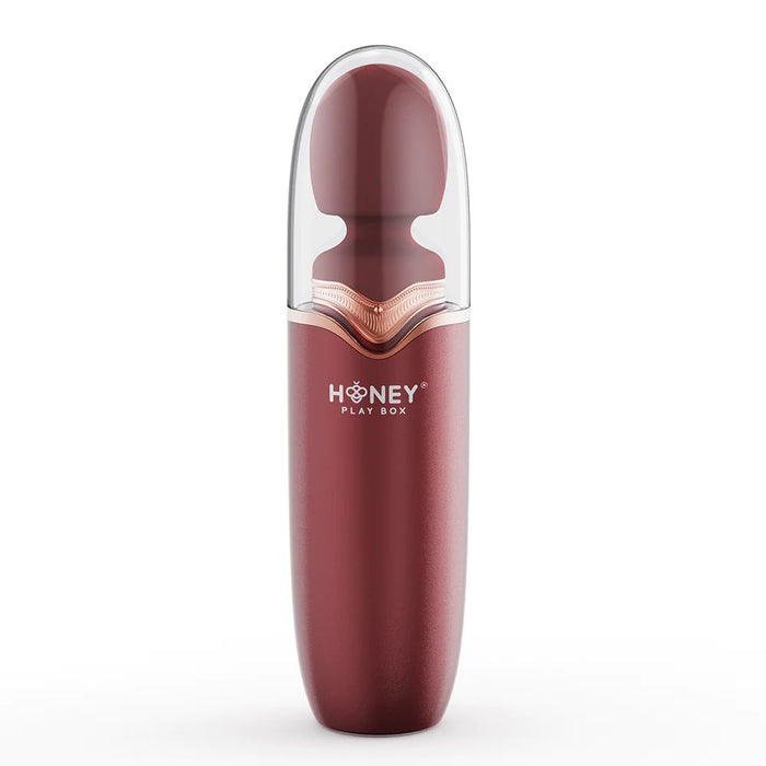 Discover the sleek Stormi Powerful Heating Wand Vibrator from Honey Play Box. This red personal massager boasts 9 vibration patterns and a deep rumbling motor, combined with an ergonomic shape for optimal comfort. It features a translucent cap that covers the top half, offering both modern and minimalist aesthetics.