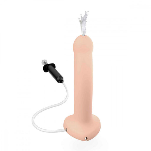 An image of the Strap-On-Me 5.7 Inch Silicone Squirting Cum Dildo - Vanilla by Lovely Planet. This novelty candle, flesh-like in color with a wick at the tip, resembles certain toys used in strap-on play. A black pump and white hose are attached to the base, hinting at interesting possibilities.