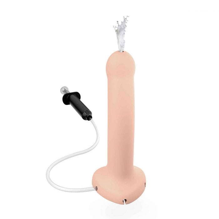 An image of the Strap-On-Me 7.5 Inch Silicone Squirting Cum Dildo in Vanilla by Lovely Planet, a beige, penis-shaped toy connected by a clear tube to a black hand pump. It features a smiling face at its base and has a small spout at the top that sprays water, perfect for playful squirting dildo fun.