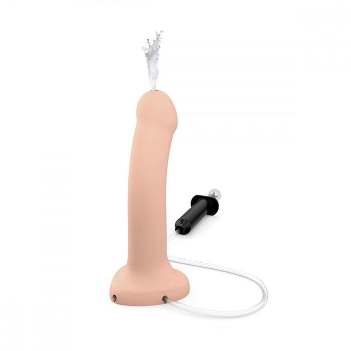 The Strap-On-Me 7.5 Inch Silicone Squirting Cum Dildo - Vanilla by Lovely Planet is a body-safe, flesh-colored dildo with an attached external pump and hose, designed to simulate ejaculation. It features a rounded tip for comfort, while the black plastic syringe-like pump connects seamlessly to enable liquid release, making it ideal for strap-on play.