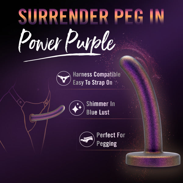 Promotional image for Blush's "Surrender Slim 4.75 Inch Silicone Beginner & Pegging Dildo" in Power Purple, compatible with harnesses and ideal for pegging enthusiasts, featuring a shimmer in Blue Lust. Highlights include its user-friendly design and adaptability for both pegging and anal play, set against a dark purple-themed background.