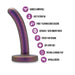 The Surrender Slim 4.75 Inch Silicone Beginner & Pegging Dildo by Blush, shown in purple with a curved shape and flared base, features icons that highlight its harness compatibility for pegging, easy strap-on use, Puria™ platinum cured silicone craftsmanship, and an Ultrasilk™ finish. It's body-safe and hypoallergenic, making it perfect for both anal and vaginal play.