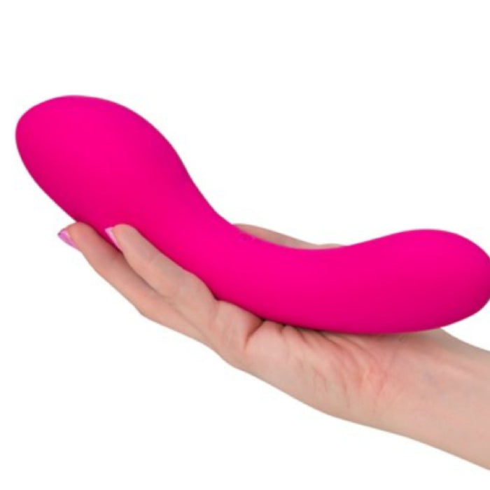 A hand holds the Swan Wand Powerful Rumbly Double Ended 2 Motor Vibrator by BMS Enterprises against a white background. The bright pink, curved, and smooth vibrator features a rounded tip and a sleek design, made from 100% silicone with powerful motors for an enhanced experience.