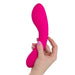 A hand with pink nail polish holds a bright pink, curved Swan Wand Powerful Rumbly Double Ended 2 Motor Vibrator by BMS Enterprises against a white background.