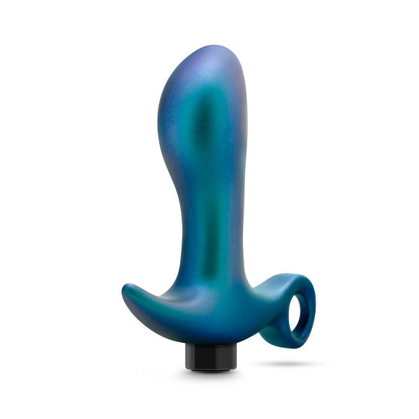 The "Teleportation Vibrating Silicone Prostate Massager & Butt Plug" by Blush in teal metallic features a curved, ergonomic design and a looped handle that enhances anal pleasure. This sleek device, when viewed from the side, promises a comfortable experience with its user-friendly features.