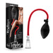 Box and product of the Temptasia Beginner's Breast and Clitoral Pumping System by Blush, featuring a clear suction cup connected to a black and red pump with a flexible hose for enhanced pleasure. Packaging includes an image of a person in lingerie.