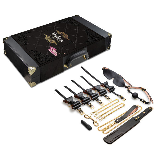 The Temptasia Safe Word Bondage Kit with Suitcase by Blush is an elegantly designed, durable vegan leather collection presented in a sophisticated black leather-bound case labeled "Fantom." This kit features an array of BDSM accessories including cuffs, chains, rope, a gag, sunglasses, and a collar. It is perfect for both beginner and intermediate players.