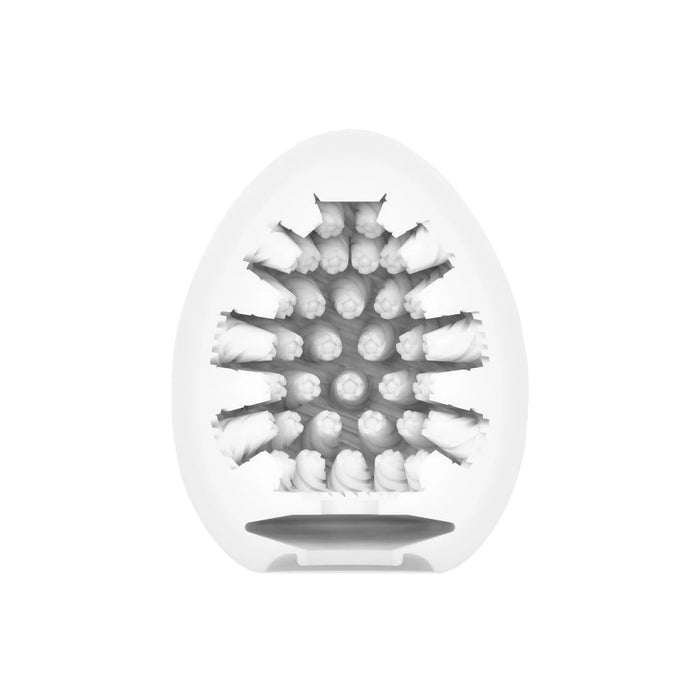 An x-ray image of a Tenga Egg Disposable Penis Masturbator - Cone cut in half, revealing the intricate arrangement of super stretchable elastomer seeds inside.