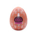 A pink-hued oval container with branding and text, likely packaging for a product from the Tenga Egg Disposable Penis Masturbator - Cone.