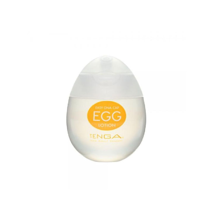 Image of a white, egg-shaped container of "Tenga Egg Disposable Penis Masturbator - Lotion" with an orange label. The container features a clear lower half and a frosted white upper half, showcasing the unique texture inside. The text "Easy Ona-Cap" is visible on the label, indicating its use as a disposable masturbation sleeve.