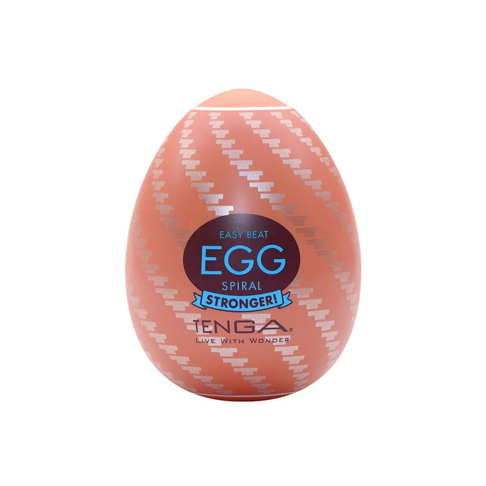 A product photo of a Tenga Egg Disposable Penis Masturbator - Spiral from the TENGA EGG Series. The oval-shaped packaging features a spiral pattern in a light color against an orange background. The label reads "Easy Beat EGG Spiral STRONGER!" in blue and white text, with the brand name "Tenga" at the bottom. Made with super-stretchable material.