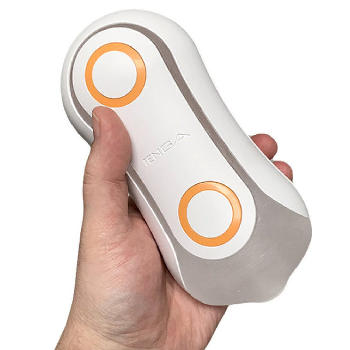 Tenga Flip Orb  Penis Masturbator - Orange Crash held in a hand