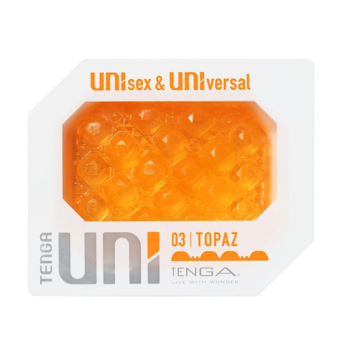 The image shows the packaging of a discreet masturbator from the Tenga Uni Topaz Textured Finger Sleeve series in a hexagonal shape with an orange, bubble-textured design. It features the labels "unisex & universal.