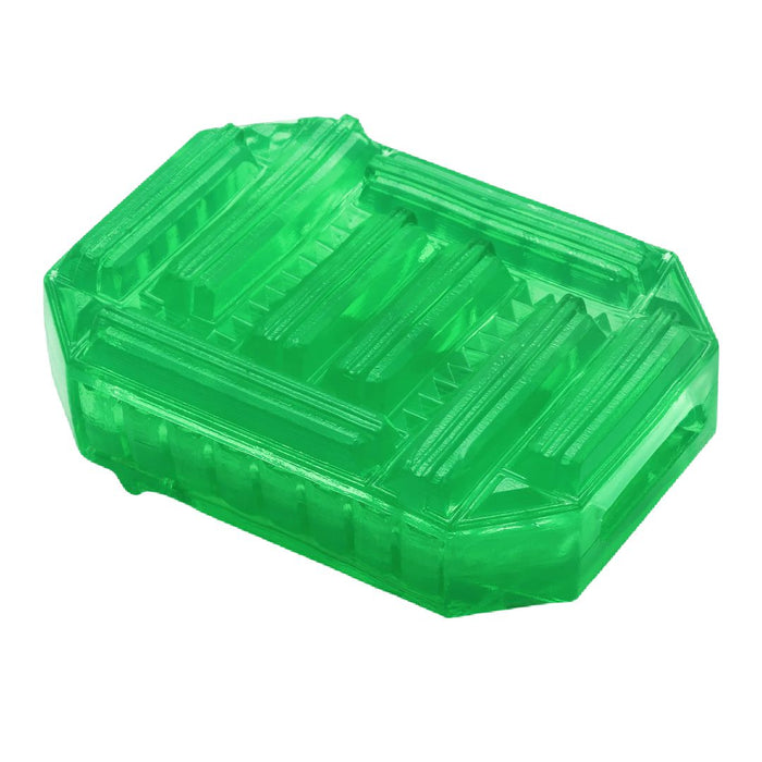 A discreet, transparent green plastic object resembling a small container or mold with intricate raised patterns on its surface, isolated on a white background by Tenga Uni Variety Pack Textured Finger Sleeves for Stroking and Clit Massage.