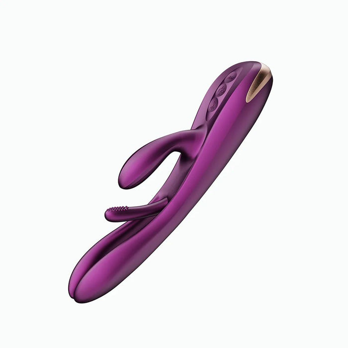 The Terri App-Controlled Kinky Finger Tapping Rabbit Vibrator from Honey Play Box is a purple, dual-stimulation rabbit vibrator with a curved design and a small clitoral stimulator. It includes control buttons on its surface for customizable vibrating modes and features a metallic accent on one end. Ideal for g-spot stimulation, the vibrator is shown on a white background.