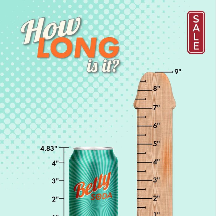 A poster with the title "How LONG is it?" shows a Betty Soda can measuring 4.83 inches next to a wooden ruler shaped like *The Perfect P-Spot Cock 9 Inch Suction Cup Dildo - Black* by *Doc Johnson* that is 9 inches long. The background features a teal color with white halftone dots.