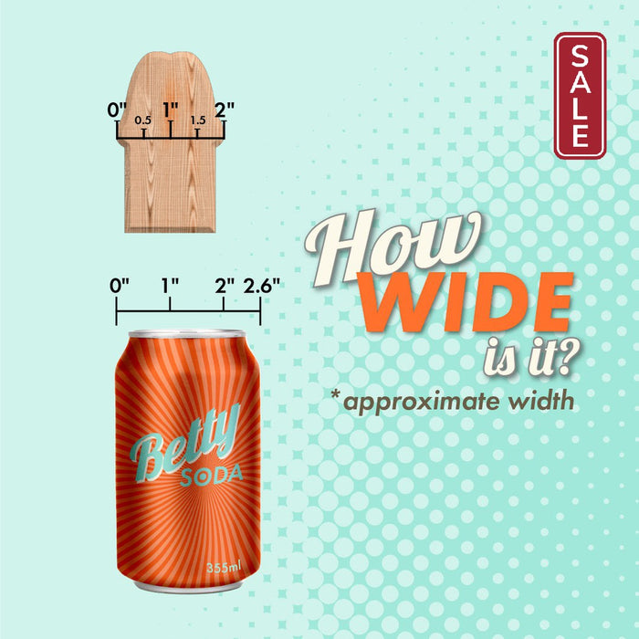 An image shows a 2x4 wooden plank piece and a soda can labeled "Betty Soda" with measurements. The text reads "How Wide is it?" The can measures 2.6 inches wide, while the plank is 1.5 inches at its narrowest and 2 inches at its widest, creating an ideal comparison for The Perfect P-Spot Cock 9 Inch Suction Cup Dildo - Black by Doc Johnson dimensions.