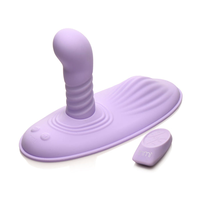 The Thrust 'N' Grind Thrusting & Vibrating Silicone Grinder with Remote by XR Brands is a lavender-colored silicone sex toy featuring a ribbed shaft, thrusting vibrations, and a wavy pattern on one side. It includes a wireless remote control for easy and simple operation, and buttons on its base to enhance your experience.