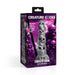 The product box showcases the Tower of Doom Silicone Skull Dildo from XR Brands, crafted with premium silicone and designed with stacked skulls. The packaging is branded with "CREATURE COCKS" and features a purple and black background adorned with numerous skulls. The text boldly states, "This skull cock is ready to dig deep in your hole!