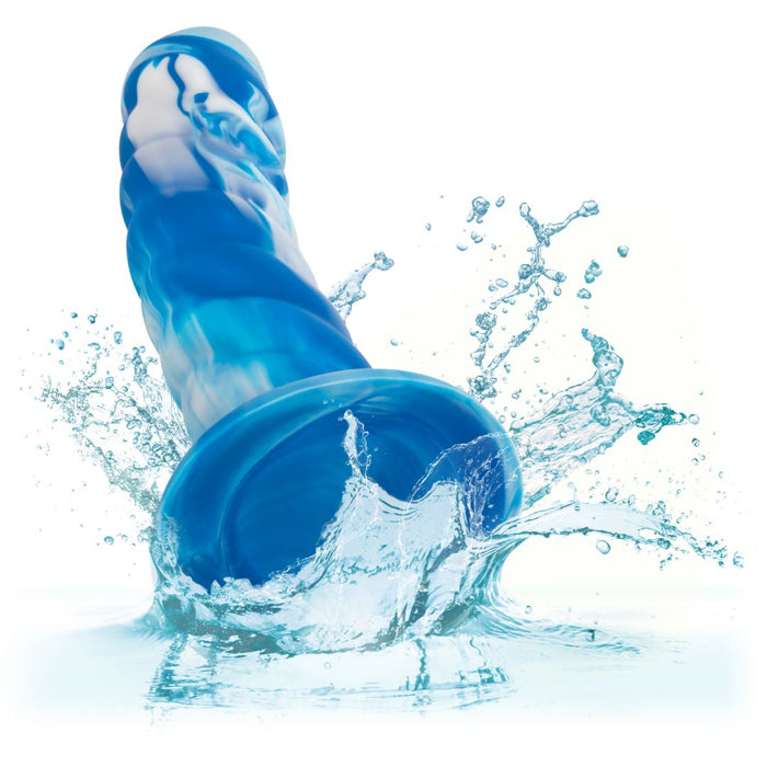 A Twisted Love Ribbed 5.5 Inch Beginner Silicone Dildo by CalExotics splashing into water, creating an energetic and dynamic spray of droplets.