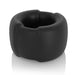 A black cylindrical ring with a thick, smooth surface resting on a white reflective background. The ring has an even texture and appears to be made of weighted steel, adding a modern edge. The design is simple and sleek, ideal for those seeking enhanced performance. This is the Vers VERS Silicone Ball Stretcher with Weighted Steel Interior - Black.