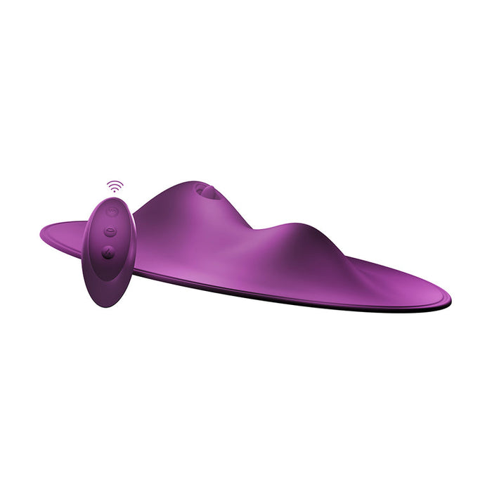 The VibePad 2 Ride On Hands-Free Humping Vibrator with Licking Tongue by Orion is a sleek, modern-looking electronic device in a vibrant purple color. It features a waterproof remote control with three buttons that match the device's color and boast a wireless signal icon. The main vibrator has a curved, ergonomic shape with smooth contours.