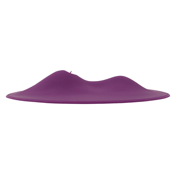 The VibePad 2 Ride On Hands-Free Humping Vibrator with Licking Tongue by Orion features a sleek, modern design with a smooth, purple silicone disc surface accentuated by gentle, wave-like hills. This waterproof and flexible object offers an innovative experience.